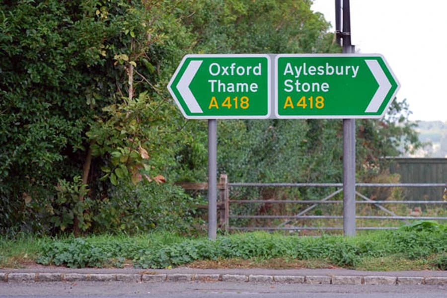 a uk road sign in the countryside, between Oxford and Aylesbury