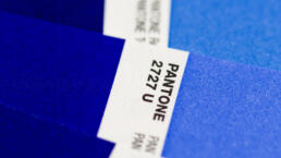 a macro image of blue pantone colour swatches