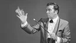 a vintage image of a magician conjuring flames from his hand