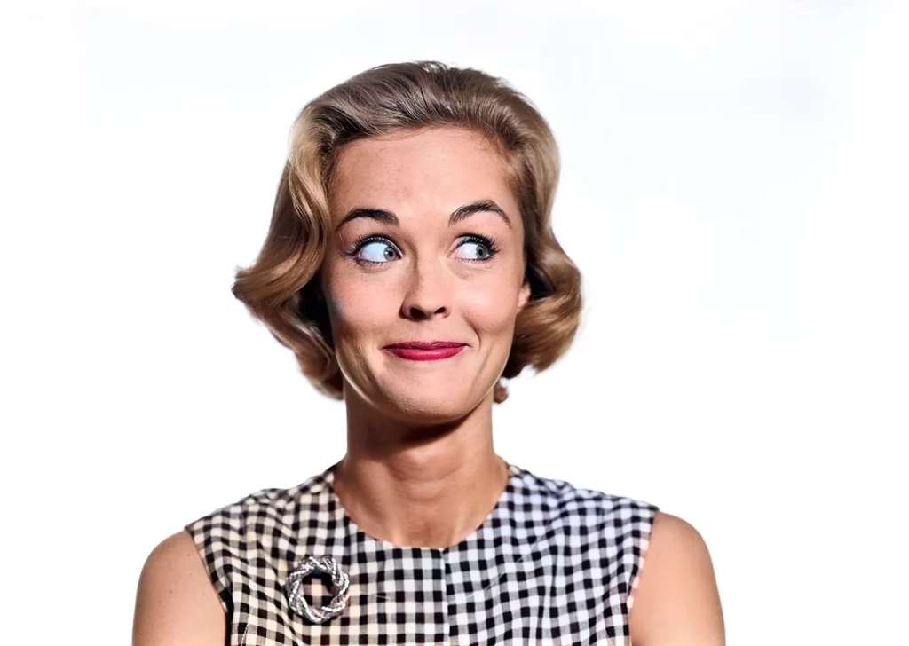 a mid 20th century lady in full colour, she is looking to the right side of the frame